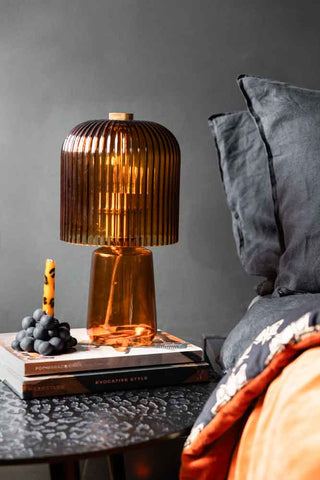 Lifestyle image of the Amber Seventies Glass Table Lamp