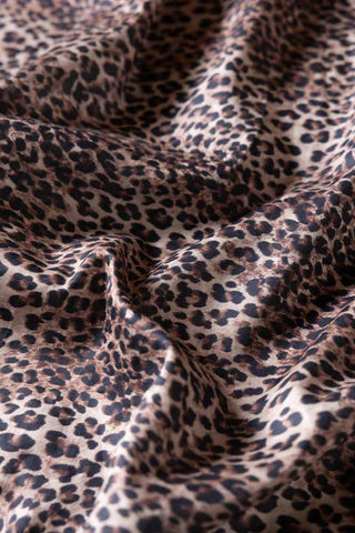 Close-up of the Signature Leopard Print Cotton Sateen Fitted Sheet.