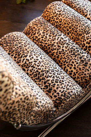 A detail shot of the padded seat on the Signature Leopard Print Lounger Chair. 
