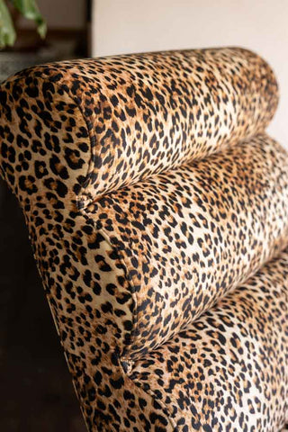The detailing of the curved headrest on the Signature Leopard Print Lounger Chair.
