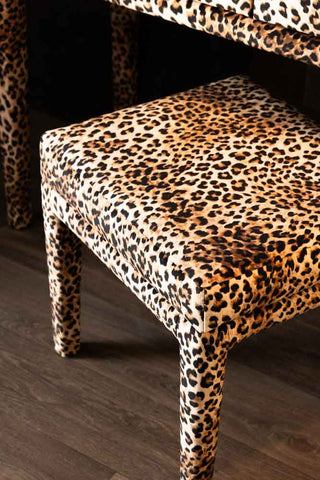 A close up of the stool from the Signature Leopard Print Velvet Dressing Table Set. 
