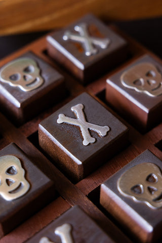 Close-up image of the Skull & Bones Tic Tac Toe Board Game