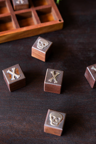 Image of the pieces for the Skull & Bones Tic Tac Toe Board Game