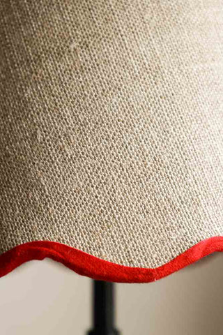 Detail image of the Slim Table Lamp with Red Scalloped Linen Shade. 