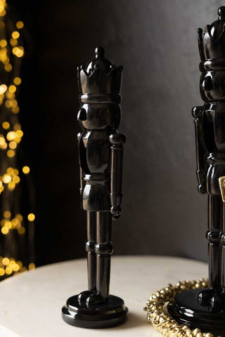 Image of the small nutcracker in the Set Of 2 Black Christmas Nutcracker Decorations