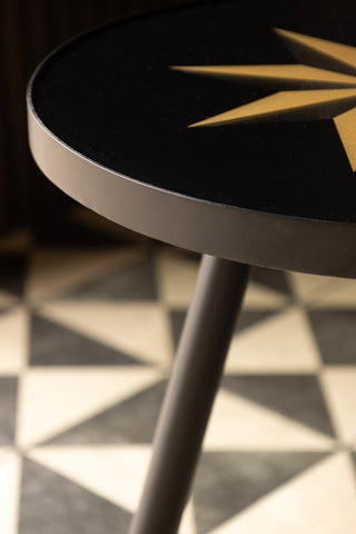 Lifestyle image of the Small Black Star Side Table close up