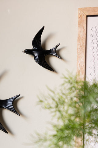Image of the Small Black Swallow Wall Decoration on a wall