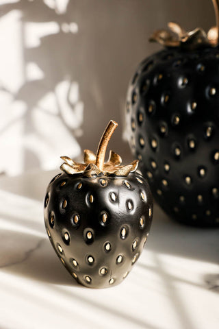 Lifestyle image of the Small Black & Gold Strawberry Ornament