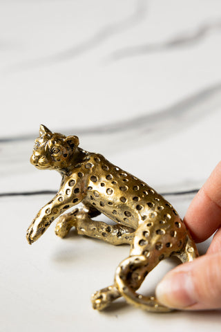 Close-up image of the Small Gold Lounging Leopard Decoration
