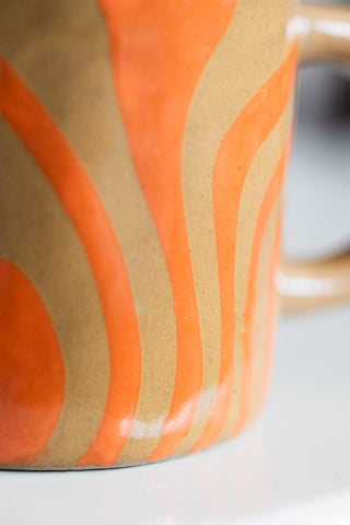 Close-up image of the Small Orange Abstract Marble Mug