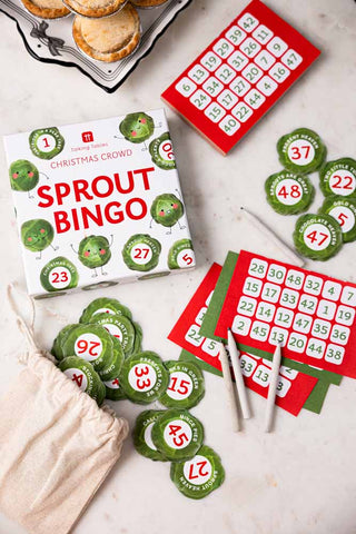 The Sprout Bingo Christmas Party Game displayed laid out on a white surface with a plate of mince pies.