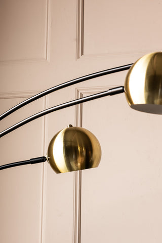 Close-up image of the Statement Black & Gold Retro Arch Floor Lamp