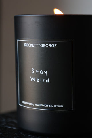 Close-up image of the Rockett St George Stay Weird Cedarwood & Frankincense Candle