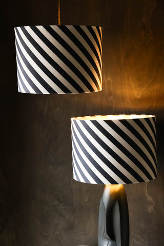 Image of the Stripe Light Shade on a black table lamp base and hanging as a pendant light.