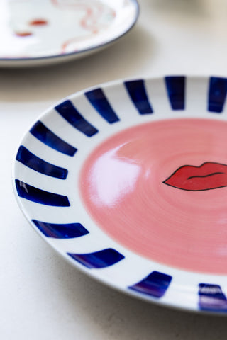 Close-up image of the Striped Border & Lips Ceramic Serving Plate
