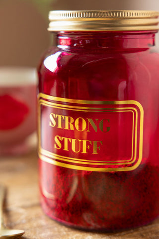 Close-up image of the Strong Stuff Hot Pink Glass Storage Jar