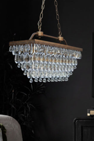 Crystal chandelier hanging against a dark background
