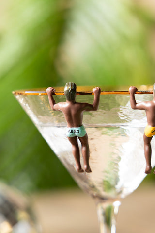 Close-up of two of the Set of 6 Hunky Buddies Wine Glass Charms.