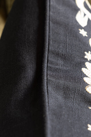 Close-up of the edge of the Swan Tapestry Embroidered Cushion.