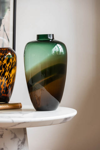 Lifestyle image of the Tall Dark Green & Brown Glass Vase