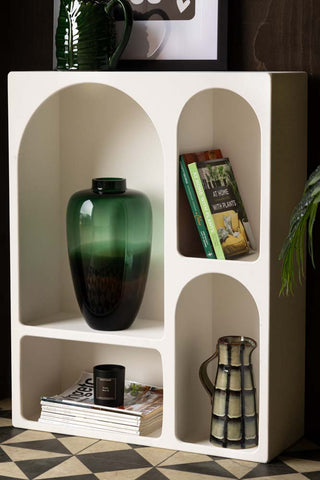 Lifestyle image of the Tall White Alcove Shelf displayed with various decorative accessories inside and on the top.