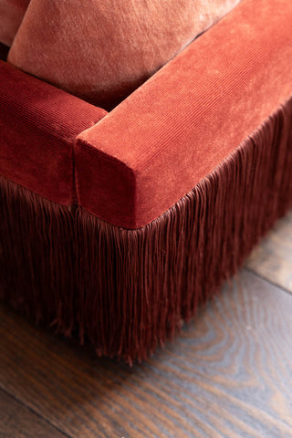 Close-up image of the Tassel Bed in Sienna Orange Luxe Needlecord Velvet - Available in 3 Sizes