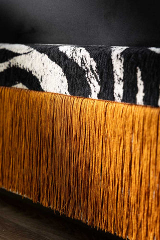 Close-up image of the Tassel Bed in Zebra Print Needlecord Velvet - Available in 2 Sizes