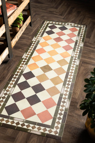 The Terracotta Checkered Durable Runner shown against wooden flooring in a kitchen.