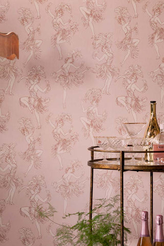 The Cha Cha Cha Wallpaper in Watermelon Blush shown with a gold bar cart.