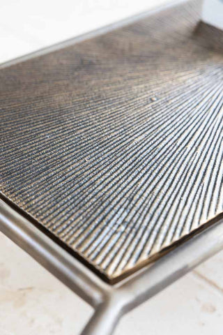 Detail image of the finish for the Henry Antique Brass & Glass Coffee Table