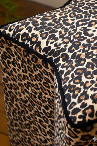 Close-up image of the The Leopard Print Velvet Star Footstool