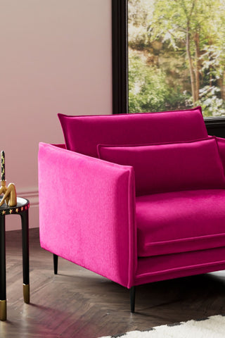 Close-up of one side of The Lola Snuggle Seat in Harry's Pink Velvet.