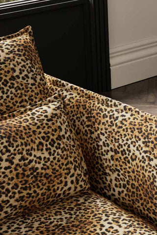 Close-up of the back/cushion of The Lola Snuggle Seat in Leopard Print Velvet.