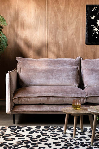Close-up of The Lola 4 Seater Sofa in Luxe Pink Velvet, styled with various accessories.