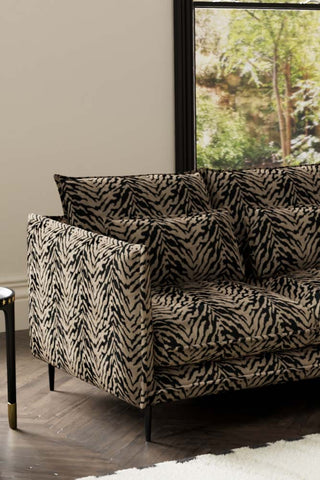 Close-up of one side of The Lola 2 Seater Sofa in Tiger Print Velvet.