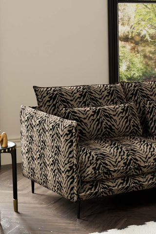 Close-up of one side of The Lola 3 Seater Sofa in Tiger Print Velvet.