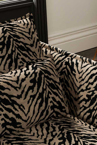 Close-up of the back/cushions of The Lola 3 Seater Sofa in Tiger Print Velvet.