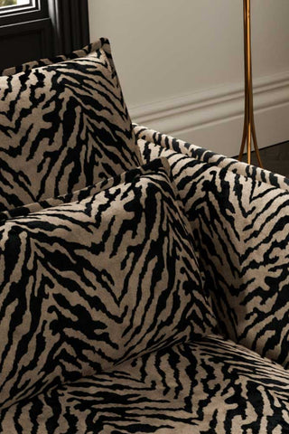 Close-up of the back/cushion of The Lola 4 Seater Sofa in Tiger Print Velvet.