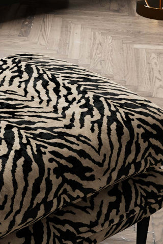 Close-up of the top of The Lola Footstool in Tiger Print Velvet.