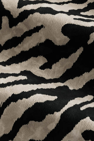 Close-up of the fabric of The Lola Footstool in Tiger Print Velvet.
