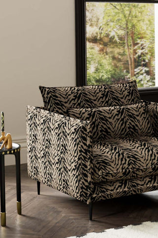 Close-up of one side of The Lola Snuggle Seat in Tiger Print Velvet.