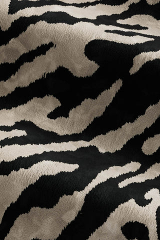 Close-up of the fabric of The Lola Snuggle Seat in Tiger Print Velvet.