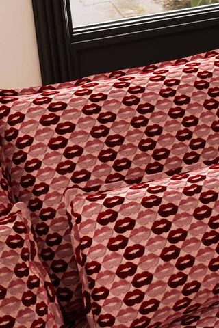 Close-up of the cushions on The Lola 2 Seater Sofa in Woven Red & Pink Lips Velvet.