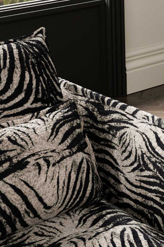 Close-up of the back/cushions of The Lola Snuggle Seat in Zebra Print Velvet.