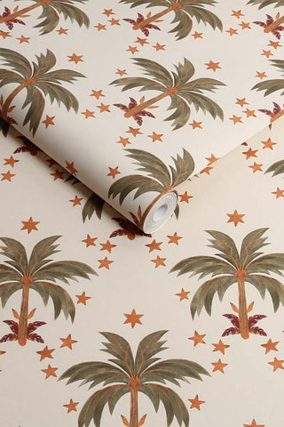 The roll of The Midnight Palms Wallpaper in Ivory. 