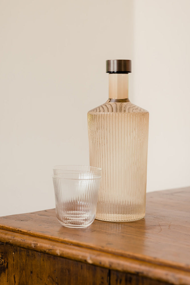 The Paveau Ribbed Glass Carafe in Amber Rockett St
