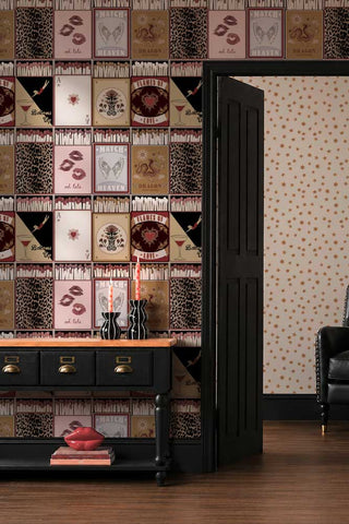 The Perfect Match Wallpaper in Peach shown in a hallway with a console table and an open door leading through to a starry wallpapered living room.