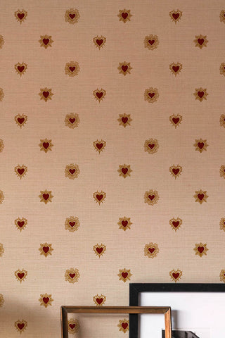 The Sacred Hearts Wallpaper in Ivory Red styled with some art and frames. 