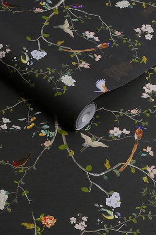 The roll of The Secret Garden Chinoiserie Wallpaper in Black Ink.