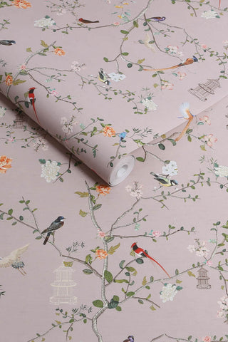 The roll of The Secret Garden Chinoiserie Wallpaper in Dusty Lilac.